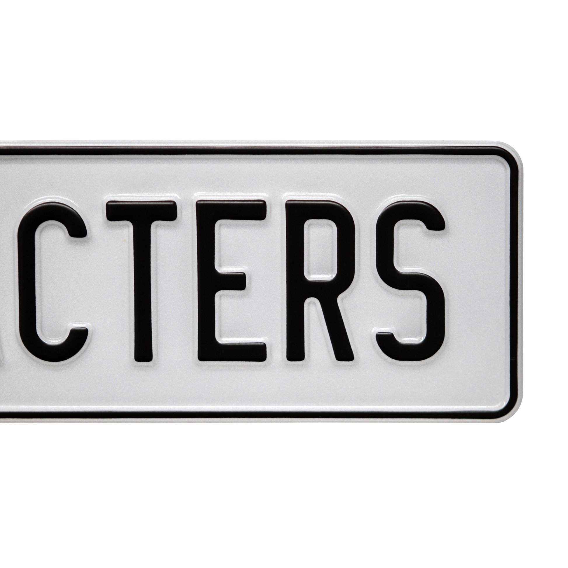 black on reflective white 14 character european license plate close up