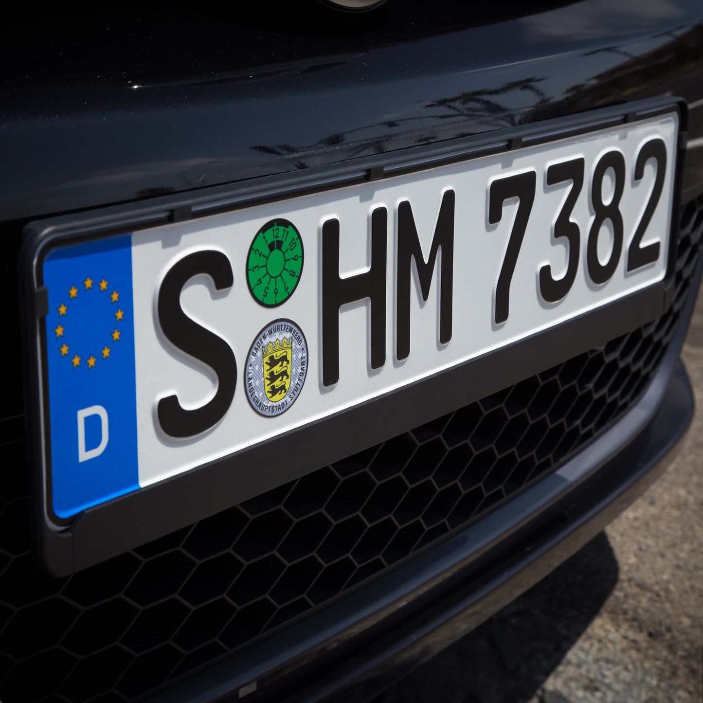 European license plate installed in mounting frame